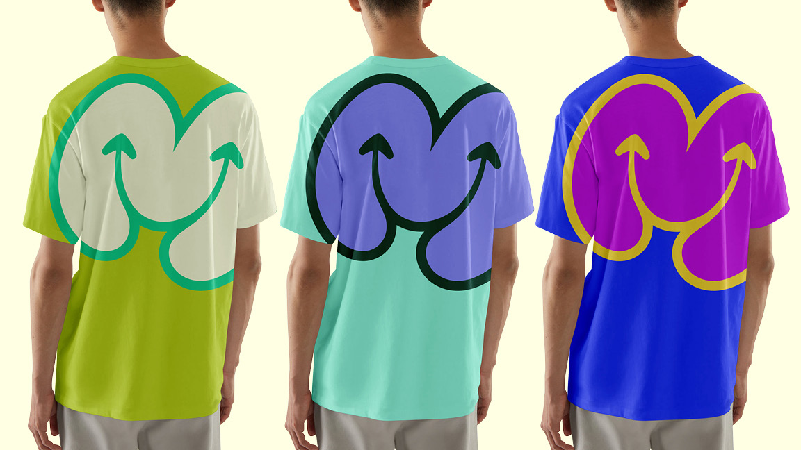 Three Magical Kids team t-shirts with the smiling M